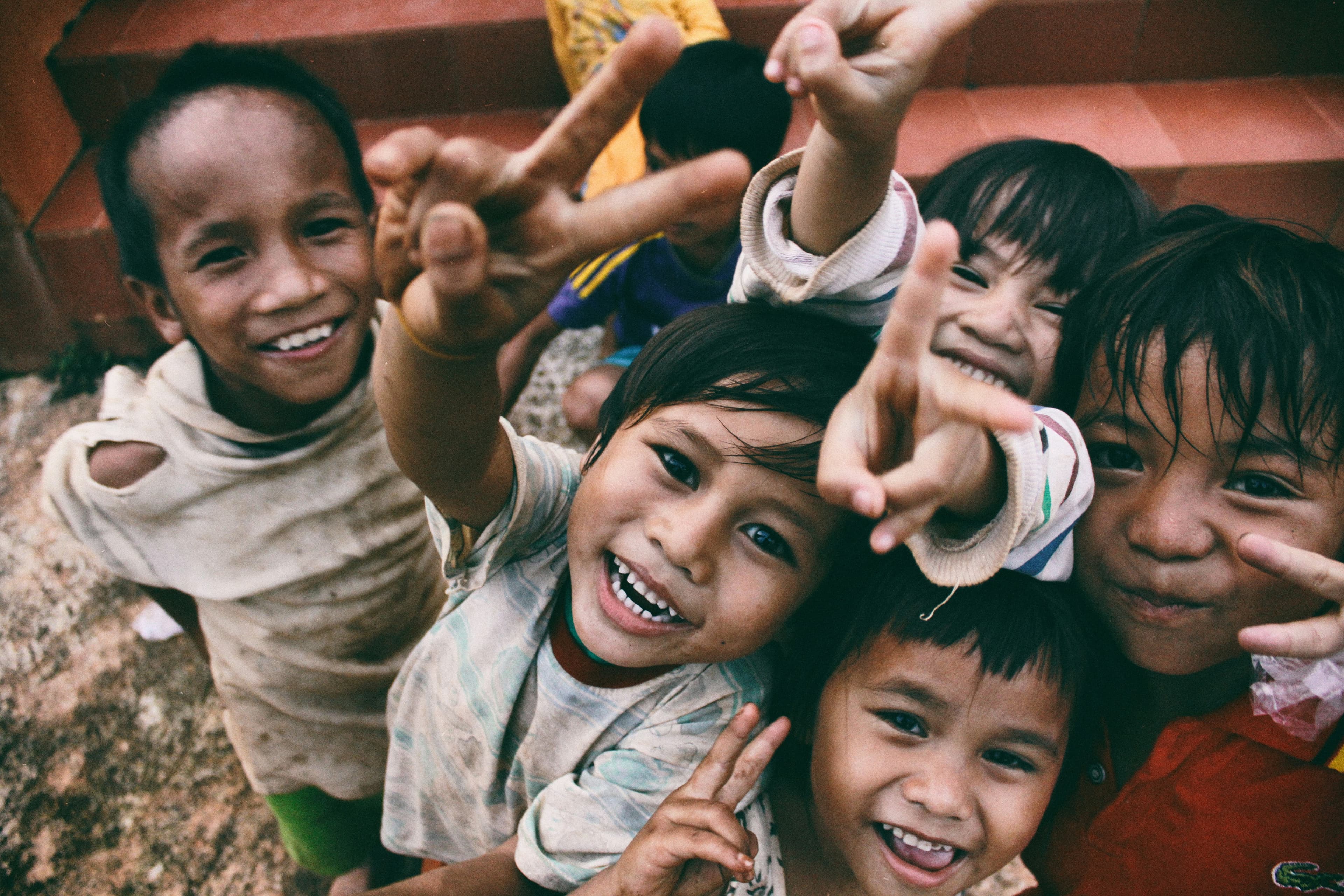 A group of children smiling at the camera